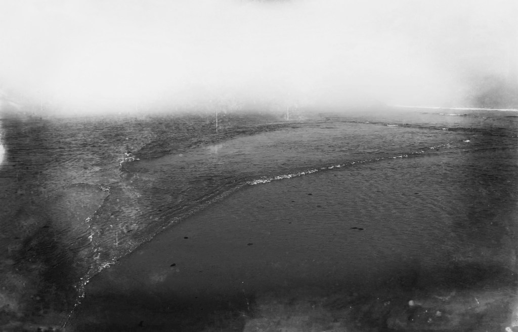 black and white photograph of a retreating wave taken at Head of the Meadow in Truro, Massachusetts